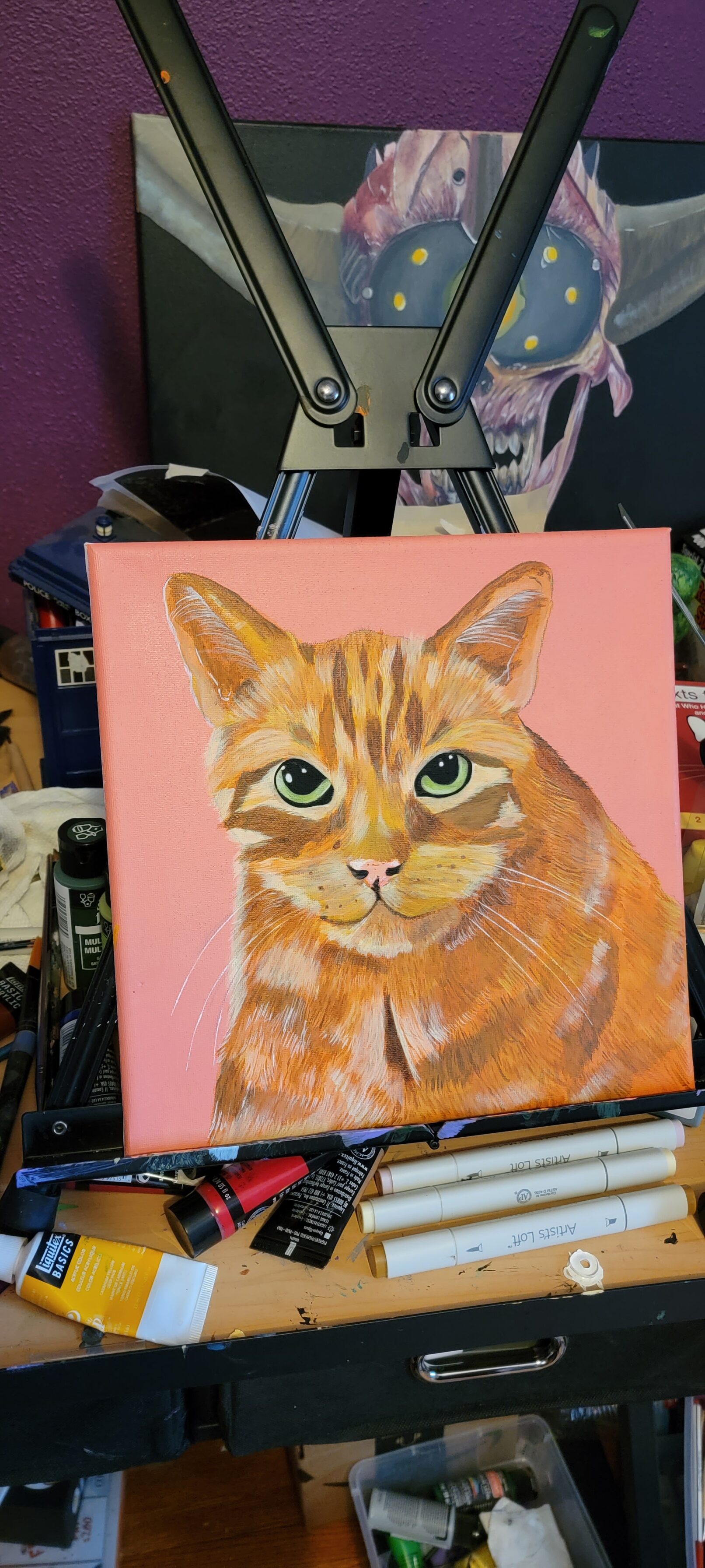 acrylic painting of an orange cat on a peach background